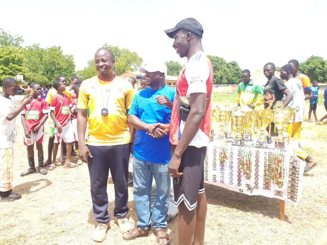 Jawara Foundation representative handing over trophies and medals at the Upper West Regional Inter-District Games in Nandom